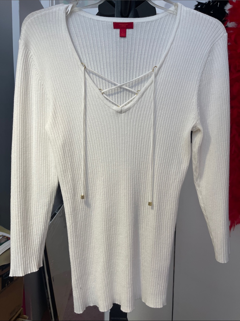 Jennifer Lopez cream-colored lace-up v-neck ribbed sweater